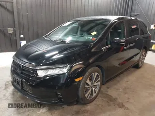 2021 Honda Odyssey Touring with VIN 5FNRL6H83MB040138, listed as a IAAI auction lot 39150096 with 61,322 mi miles and . Bid and sale history available at DreamBid. Image 2.