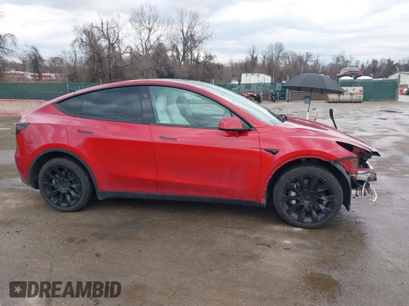 2023 Tesla Model Y Long Range with VIN 7SAYGDEE1PA169031, listed as a IAAI auction lot 41660766 with 35,253 mi miles and . Bid and sale history available at DreamBid. Image 14.