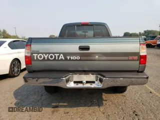1996 Toyota T100 SR5 z VIN JT4UN24D3T0032313, wystawiony jako Copart lot #70693914 z przebiegiem 210 021 mil mil oraz Szkody całkowita. Historia ofert i sprzedaży dostępna na DreamBid. Obrazek 6.