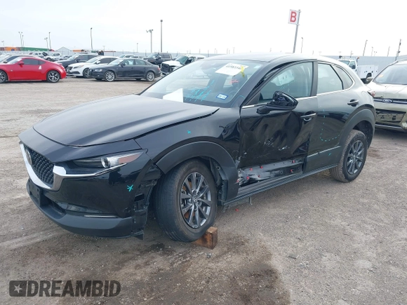 2021 Mazda CX-30 2.5 S with VIN 3MVDMAAL2MM303321, listed as a IAAI auction lot 41583346 with 57,122 mi miles. Bid and sale history available at carsss.com. Image 2.