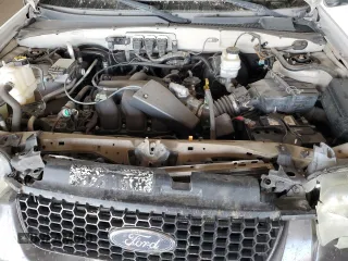 2006 Ford Escape XLT with VIN 1FMYU03166KA73605, listed as a Copart auction lot 71968524 with 143,742 mi miles and Salvage Title. Bid and sale history available at carsss.com. Image 13.