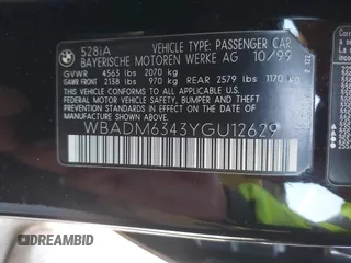 2000 BMW 5 Series 528iA with VIN WBADM6343YGU12629, listed as a IAAI auction lot 41963814 with 206,922 mi miles. Bid and sale history available at carsss.com. Image 9.