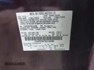 2011 Ford Taurus SE with VIN 1FAHP2DW7BG136988, listed as a IAAI auction lot 42002512 with 145,847 mi miles. Bid and sale history available at carsss.com. Image 9.
