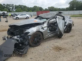 2019 BMW M5 with VIN WBSJF0C57KB447306, listed as a Copart auction lot 71837424 with 0 mi miles and Salvage Title. Bid and sale history available at carsss.com. Image 1.