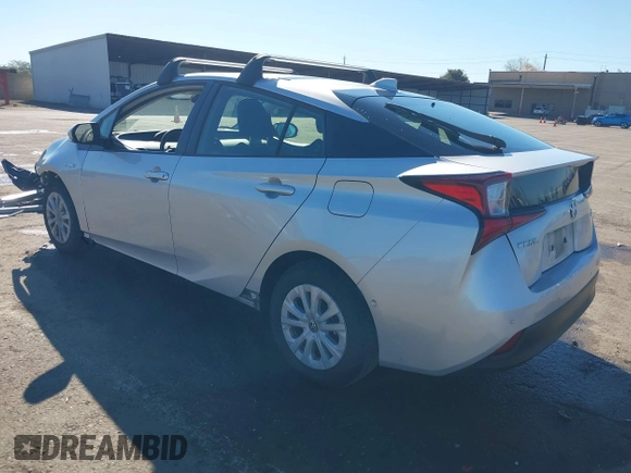 2021 Toyota Prius L Eco with VIN JTDKAMFU5M3130478, listed as a IAAI auction lot 41867606 with 52,223 mi miles. Bid and sale history available at carsss.com. Image 3.