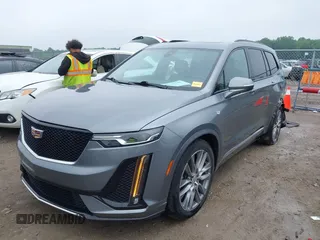 2021 Cadillac XT6 Sport with VIN 1GYKPGRS6MZ128112, listed as a IAAI auction lot 42415342 with 57,680 mi miles and . Bid and sale history available at DreamBid. Image 2.