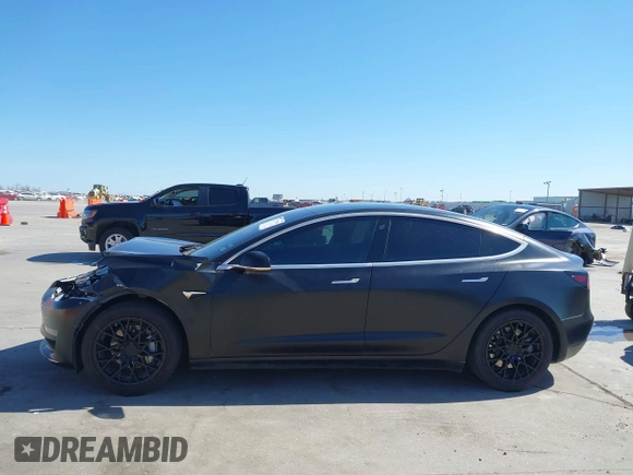 2020 Tesla Model 3 Standard Range Plus with VIN 5YJ3E1EA0LF597761, listed as a IAAI auction lot 41773918 with 89,957 mi miles. Bid and sale history available at carsss.com. Image 13.