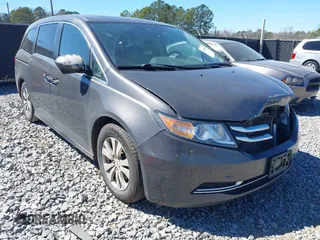 2014 Honda Odyssey EX-L with VIN 5FNRL5H61EB014695, listed as a IAAI auction lot 41694860 with 261,265 mi miles and . Bid and sale history available at DreamBid. Image 1.