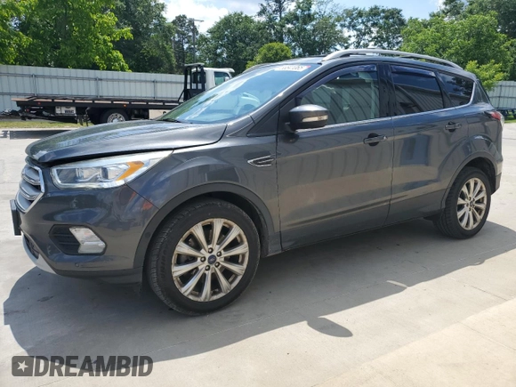 2018 Ford Escape Titanium with VIN 1FMCU0J93JUB20136, listed as a Copart auction lot 56841065 with 129,954 mi miles and Salvage title. Bid and sale history available at DreamBid. Image 1.