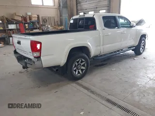 2016 Toyota Tacoma SR5 with VIN 3TMDZ5BN2GM007990, listed as a IAAI auction lot 41288736 with 76,179 mi miles. Bid and sale history available at carsss.com. Image 4.