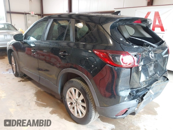 2016 Mazda CX-5 Touring with VIN JM3KE2CY7G0867355, listed as a IAAI auction lot 41963169 with 117,727 mi miles and . Bid and sale history available at DreamBid. Image 3.