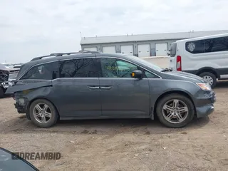 2012 Honda Odyssey Touring with VIN 5FNRL5H99CB028304, listed as a IAAI auction lot 42031916 with 216,185 mi miles and . Bid and sale history available at DreamBid. Image 14.