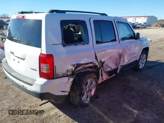 2014 Jeep Patriot Latitude with VIN 1C4NJPFB0ED719270, listed as a IAAI auction lot 40870355 with 207,613 mi miles and . Bid and sale history available at DreamBid. Image 4.