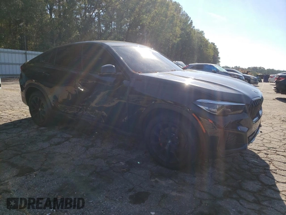 2023 BMW X6 xDrive40i z VIN 5UXCY6C04P9P46153, wystawiony jako Copart lot #81151634 z przebiegiem Nie podano mil oraz Szkoda całkowita • Salvage title. Historia ofert i sprzedaży dostępna na DreamBid. Obrazek 4.