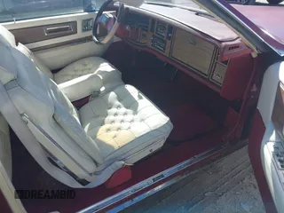 1984 Cadillac Eldorado z VIN 1G6AL5789EE608519, wystawiony jako IAAI lot #41577924 z przebiegiem 12 416 mil mil oraz . Historia ofert i sprzedaży dostępna na DreamBid. Obrazek 5.
