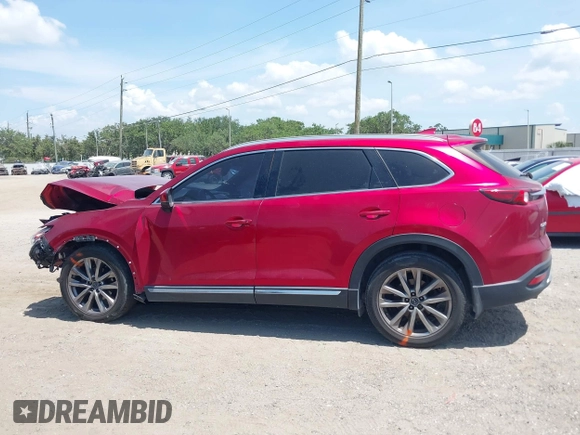 2019 Mazda CX-9 Grand Touring z VIN JM3TCADY5K0302436, wystawiony jako IAAI lot #42323545 z przebiegiem Nie podano mil oraz . Historia ofert i sprzedaży dostępna na DreamBid. Obrazek 14.