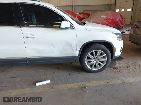 2012 Volkswagen Tiguan S z VIN WVGBV7AXXCW572690, wystawiony jako IAAI lot #42074464 z przebiegiem 133 049 mil mil oraz . Historia ofert i sprzedaży dostępna na DreamBid. Obrazek 13.