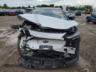 2023 Subaru Solterra Touring with VIN JTMABABA4PA003434, listed as a Copart auction lot 59837165 with 9,587 mi miles and Salvage title. Bid and sale history available at DreamBid. Image 5.