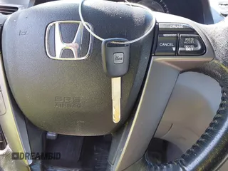 2011 Honda Odyssey EX-L with VIN 5FNRL5H6XBB073482, listed as a IAAI auction lot 42090463 with 213,061 mi miles and . Bid and sale history available at carsss.com. Image 11.