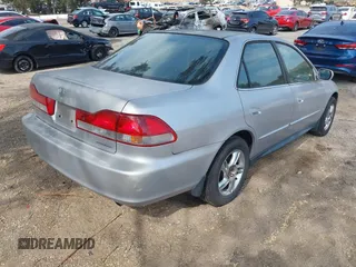 2002 Honda Accord SE z VIN JHMCG66802C027742, wystawiony jako IAAI lot #42373110 z przebiegiem 141 167 mil mil oraz . Historia ofert i sprzedaży dostępna na DreamBid. Obrazek 4.