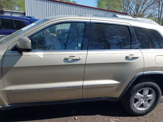 2011 Jeep Grand Cherokee Laredo with VIN 1J4RR4GG8BC590094, listed as a IAAI auction lot 41990149 with 178,510 mi miles. Bid and sale history available at carsss.com. Image 14.