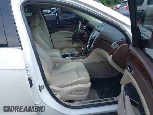 2014 Cadillac SRX Performance Collection with VIN 3GYFNFE34ES677712, listed as a IAAI auction lot 42668059 with 150,135 mi miles and . Bid and sale history available at DreamBid. Image 5.