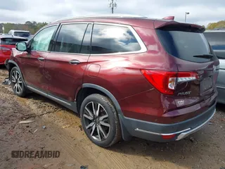 2020 Honda Pilot Touring 8-Passenger with VIN 5FNYF5H94LB012062, listed as a IAAI auction lot 40806740 with 115,431 mi miles and . Bid and sale history available at DreamBid. Image 3.