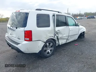 2014 Honda Pilot Touring with VIN 5FNYF4H97EB046879, listed as a IAAI auction lot 42017280 with 167,564 mi miles and . Bid and sale history available at carsss.com. Image 4.