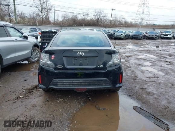 2014 Scion tC with VIN JTKJF5C74E3069104, listed as a IAAI auction lot 41579797 with 130,668 mi miles. Bid and sale history available at carsss.com. Image 16.