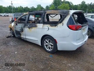 2020 Chrysler Pacifica Touring L with VIN 2C4RC1BG2LR115935, listed as a IAAI auction lot 42244837 with Not provided miles and . Bid and sale history available at DreamBid. Image 3.