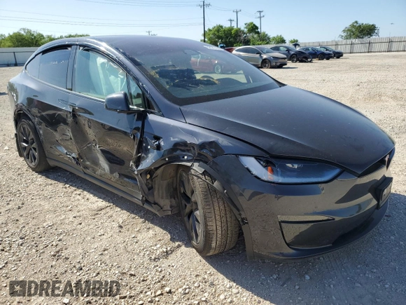 2023 Tesla Model X with VIN 7SAXCDE5XPF422163, listed as a Copart auction lot 52573185 with Not Provided miles and Salvage Title. Bid and sale history available at DreamBid. Image 4.