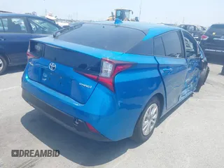 2021 Toyota Prius L Eco with VIN JTDKAMFUXM3134462, listed as a IAAI auction lot 42450931 with 89,239 mi miles and . Bid and sale history available at DreamBid. Image 4.