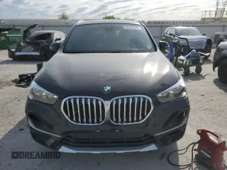 2020 BMW X1 xDrive28i with VIN WBXJG9C06L5P89796, listed as a Copart auction lot 52817235 with 95,665 mi miles and Salvage title. Bid and sale history available at DreamBid. Image 5.