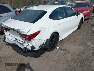 2025 Toyota Camry LE with VIN 4T1DAACK9SU084957, listed as a IAAI auction lot 41688859 with 7,396 mi miles and . Bid and sale history available at DreamBid. Image 4.