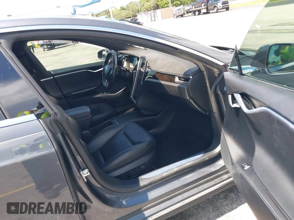 2016 Tesla Model S 70 with VIN 5YJSA1E16GF156312, listed as a IAAI auction lot 42469451 with 90,317 mi miles and . Bid and sale history available at DreamBid. Image 5.