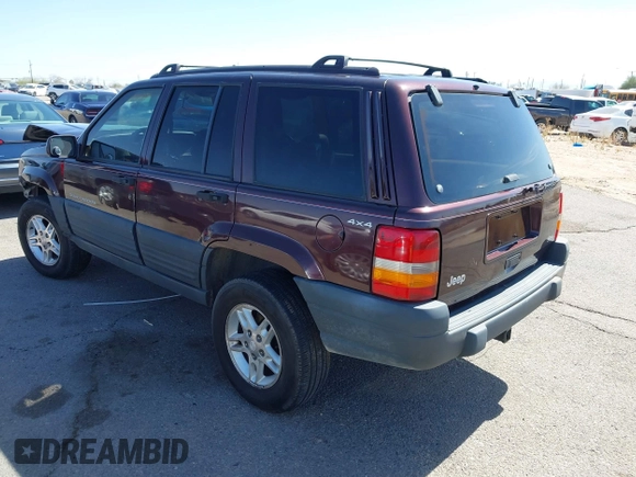 1996 Jeep Grand Cherokee Laredo with VIN 1J4GZ58S3TC391942, listed as a IAAI auction lot 41711778 with 202,765 mi miles. Bid and sale history available at carsss.com. Image 3.