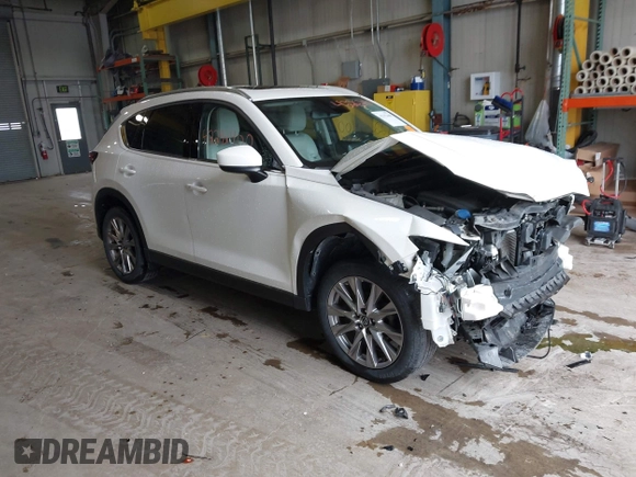 2020 Mazda CX-5 Grand Touring with VIN JM3KFADMXL0742038, listed as a IAAI auction lot 42292400 with 68,339 mi miles and . Bid and sale history available at DreamBid. Image 1.