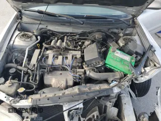 2000 Mazda 626 LX with VIN 1YVGF22C3Y5126135, listed as a Copart auction lot 70650264 with 154,517 mi miles and Salvage Title. Bid and sale history available at carsss.com. Image 13.