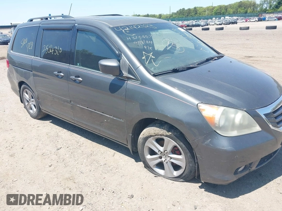 2010 Honda Odyssey Touring z VIN 5FNRL3H90AB085105, wystawiony jako IAAI lot #42142123 z przebiegiem Nie podano mil oraz . Historia ofert i sprzedaży dostępna na DreamBid. Obrazek 6.