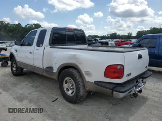 2003 Ford F-150 XL with VIN 1FTRX07W13KC28871, listed as a Copart auction lot 59003245 with 180,197 mi miles and Salvage title. Bid and sale history available at DreamBid. Image 2.