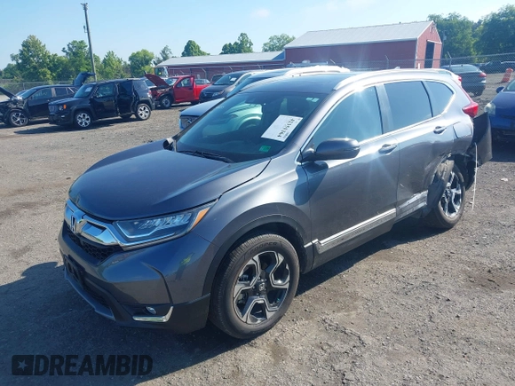 2018 Honda CR-V Touring z VIN 5J6RW2H93JL004834, wystawiony jako IAAI lot #42351364 z przebiegiem 63 746 mil mil oraz . Historia ofert i sprzedaży dostępna na DreamBid. Obrazek 17.