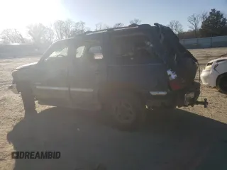2002 GMC Yukon SLT with VIN 1GKEK13Z62J148557, listed as a Copart auction lot 43246075 with 242,968 mi miles and Salvage Title. Bid and sale history available at carsss.com. Image 2.