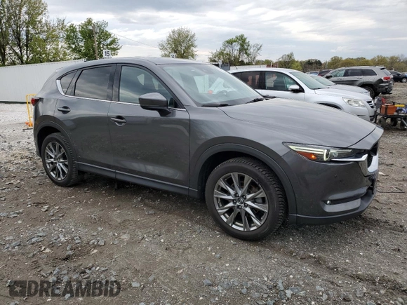 2019 Mazda CX-5 Signature with VIN JM3KFBEY3K0521581, listed as a Copart auction lot 53112925 with 62,977 mi miles and Salvage Title. Bid and sale history available at carsss.com. Image 4.
