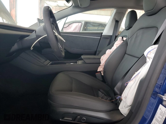 2025 Tesla Model 3 Long Range with VIN 5YJ3E1EBXSF941345, listed as a Copart auction lot 60229865 with 1,711 mi miles and Salvage title. Bid and sale history available at DreamBid. Image 7.