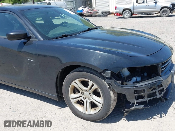 2015 Dodge Charger SE with VIN 2C3CDXBG9FH790573, listed as a IAAI auction lot 42142908 with 195,182 mi miles and . Bid and sale history available at carsss.com. Image 18.