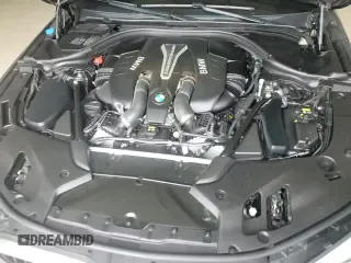 2018 BMW 5 Series M550i xDrive with VIN WBAJB9C58JB035267, listed as a Copart auction lot 64616605 with 125,365 mi miles and Clean title. Bid and sale history available at DreamBid. Image 13.