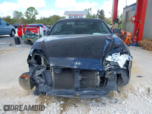 2006 Hyundai Tiburon GT z VIN KMHHN65F56U224768, wystawiony jako IAAI lot #40672721 z przebiegiem 158 535 mil mil oraz . Historia ofert i sprzedaży dostępna na DreamBid. Obrazek 13.