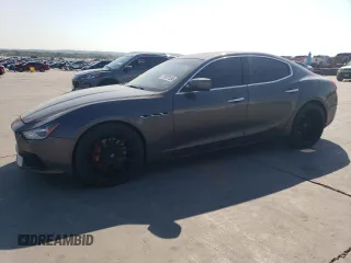2014 Maserati Ghibli S Q4 z VIN ZAM57RTA7E1085782, wystawiony jako Copart lot #75537634 z przebiegiem 111 616 mil mil oraz Szkody całkowita. Historia ofert i sprzedaży dostępna na DreamBid. Obrazek 1.