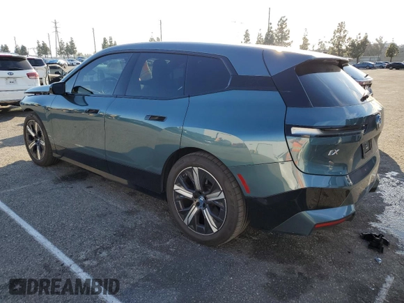 2023 BMW iX xDrive50 with VIN WB523CF03PCM54871, listed as a Copart auction lot 45988445 with 21,056 mi miles and Salvage Title. Bid and sale history available at carsss.com. Image 2.