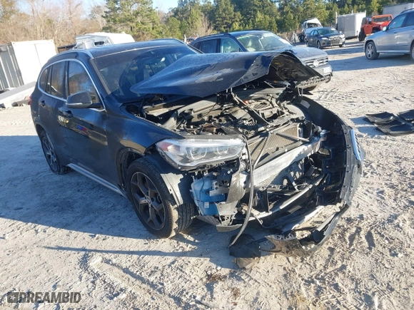 2019 BMW X1 sDrive28i with VIN WBXHU7C52K5L11560, listed as a IAAI auction lot 41354422 with 115,401 mi miles. Bid and sale history available at carsss.com. Image 1.